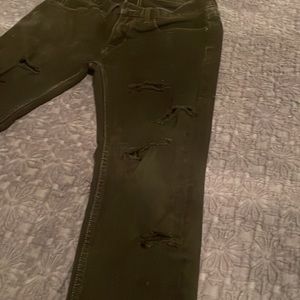 29x32 American Eagle stretch skinny jeans. Rips up the legs.